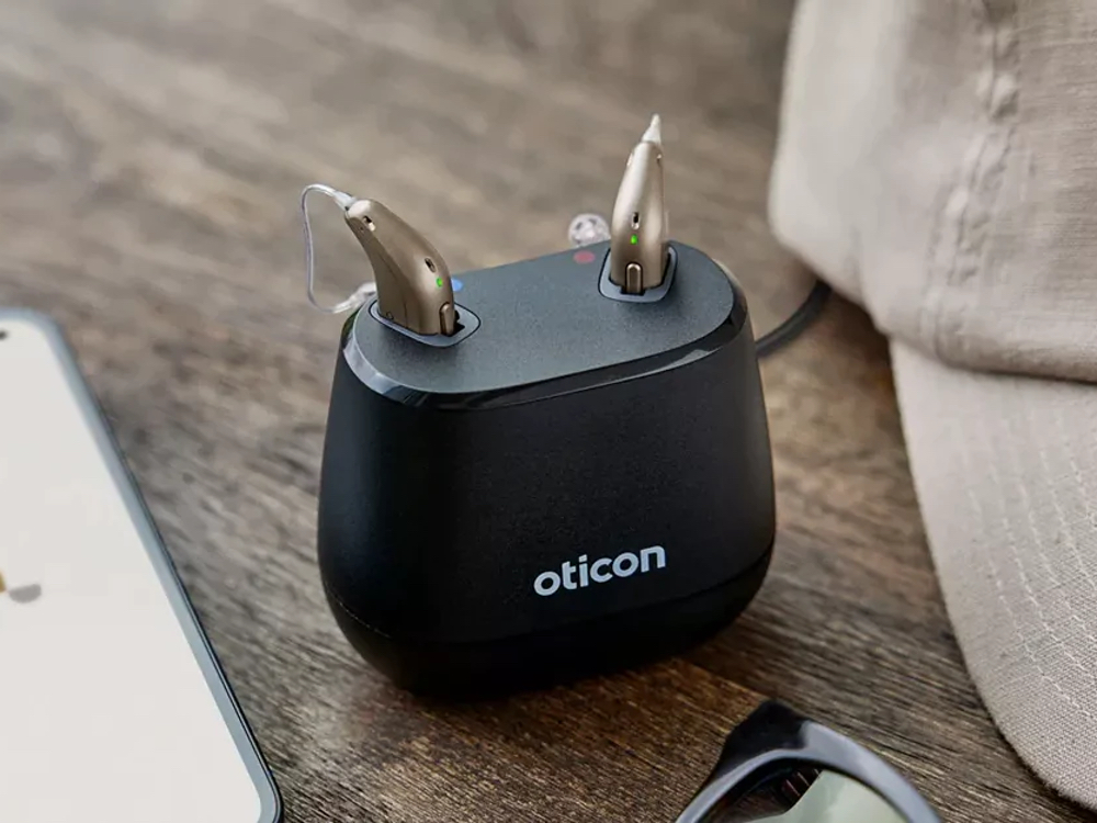 Rechargeable hearing aids charging overnight — an alternative to disposable batteries at Precision Hearing in San Antonio, TX