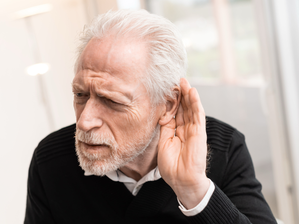 Patient learning about sensorineural, conductive, and mixed types of hearing loss at Precision Hearing in San Antonio, TX