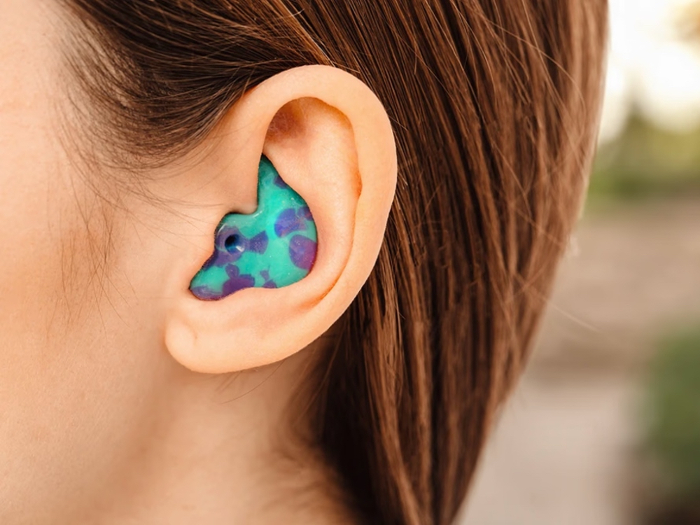 Doctor of Audiology taking a custom ear impression for hearing protection at Precision Hearing in San Antonio, TX